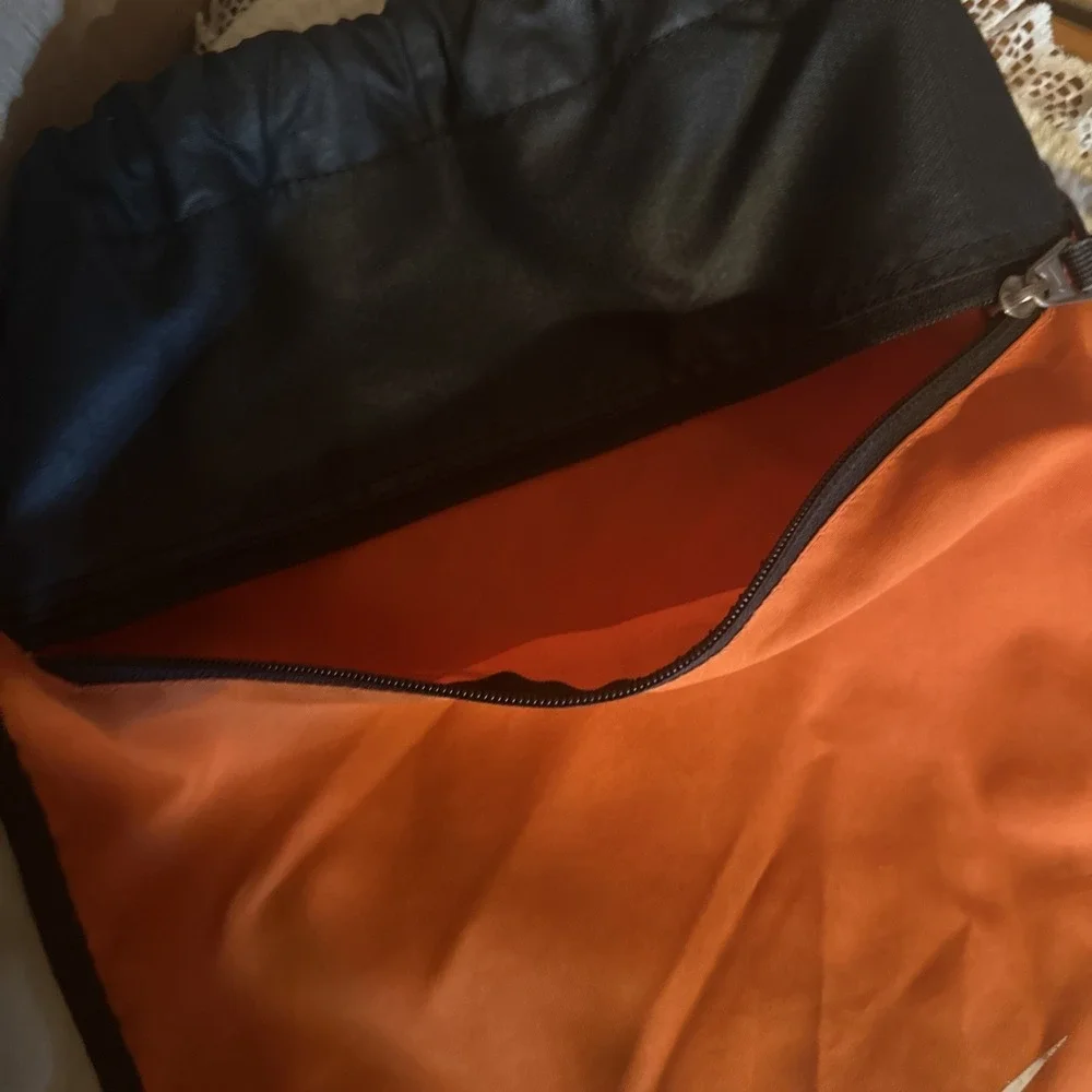 Nike Brasilia 9.5 Training Gym Sack featuring a vibrant‎ orange White Swoosh